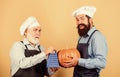 Health in his hands. mature senior bearded men in kitchen. professional restaurant cook. halloween pumpkin recipe. using