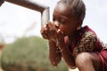 Health and Hygiene symbol, Black Young Girl Drinking Fresh Clean Water from Tap Royalty Free Stock Photo