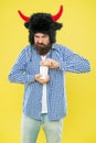 Health is important. Hipster open pill bottle yellow background. Bearded man with medicine pills or vitamin complex Royalty Free Stock Photo