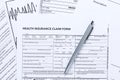 Health Insurance Claim Form with Silver Pen