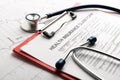 Health insurance form with stethoscope concept