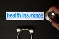 Health insurance inscription with the view of stethoscope Royalty Free Stock Photo