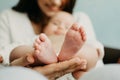 Health Insurance For Newborn Babies. Life Insurance for New Baby. Mother holding in hands feet of newborn baby. Baby Royalty Free Stock Photo