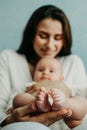 Health Insurance For Newborn Babies. Life Insurance for New Baby. Mother holding in hands feet of newborn baby. Baby Royalty Free Stock Photo