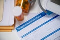 Health insurance payment form and pills on medical table Royalty Free Stock Photo