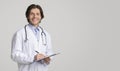 Health Insurance. Portrait Of Friendly Doctor With Medical Chart In Hands Royalty Free Stock Photo