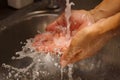 Health occupation worker washing his hands