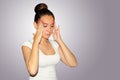 Health and pain. Young woman having strong tension headache. Closeup portrait of beautiful sick girl suffering from head migraine Royalty Free Stock Photo