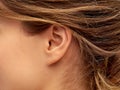 Close up of young woman face from ear side Royalty Free Stock Photo