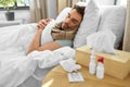 sick man with medicines on table sleeping in bed Royalty Free Stock Photo