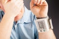 Health problem, high blood pressure. Man measuring his blood pressure Royalty Free Stock Photo