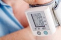 Health problem, high blood pressure. Man measuring his blood pressure Royalty Free Stock Photo