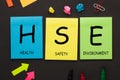 Health Safety Environment - HSE text on color notes Royalty Free Stock Photo