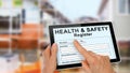 Health and Safety Register with incident report on computer tablet Royalty Free Stock Photo