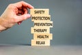 Health and safety symbol. Concept words Safety Protection Prevention Therapy Health Relax on wooden blocks on a beautiful grey