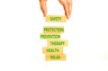 Health and safety symbol. Concept words Safety Protection Prevention Therapy Health Relax on wooden blocks on a beautiful white