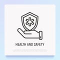 Health and safety thin line icon: hand holding shield with medical symbol. Modern vector illustration