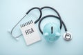 Health saving account, hsa concept on blue background Royalty Free Stock Photo