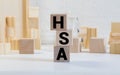 Health Savings Account HSA letters from wooden blocks Royalty Free Stock Photo