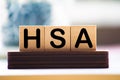 Health Savings Account HSA letters from wooden blocks Royalty Free Stock Photo