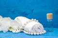 Health spa with white orchid, essentail oil and towel Royalty Free Stock Photo