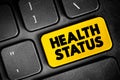 Health Status - individual\'s relative level of wellness and illness, text concept button on keyboard Royalty Free Stock Photo
