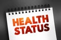 Health Status - individual\'s relative level of wellness and illness, text on notepad, concept background Royalty Free Stock Photo