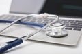 Health stethoscope on keyboard of laptop computer Royalty Free Stock Photo