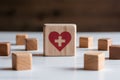 Health symbol wooden block amidst scattered blocks on white surface, signifies medical care importance