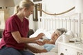 Health Visitor Giving Senior Woman Medication In Bed At Home Royalty Free Stock Photo