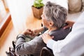 Health visitor and a senior woman during home visit. Royalty Free Stock Photo