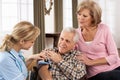 Health Visitor Taking Senior Man's Blood Pressure Royalty Free Stock Photo