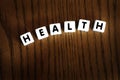 Health Word Spelled Out with Dice Letters Representing Healthy Lifestyle Royalty Free Stock Photo