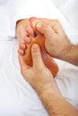 Health worker give reflexology massage