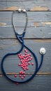 Healthcare basics Stethoscope, pills, medicine on wooden background for treatment