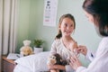 Healthcare, children and a girl at the pediatrician for an appointment or checkup in the hospital. Medical, covid and