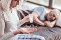 Close up of elderly woman with pills