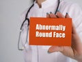 Healthcare concept about Abnormally Round Face with sign on the piece of paper