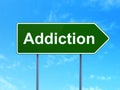 Healthcare concept: Addiction on road sign background