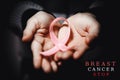 healthcare concept - child hands holding cancer awareness ribbon Royalty Free Stock Photo
