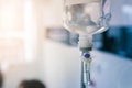 Healthcare concept, Close up of medical drip or IV drip chamber in patient room, Selective focus Royalty Free Stock Photo