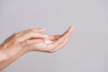 Healthcare concept. Closeup shot of young woman hands applying moisturizing hand cream Royalty Free Stock Photo