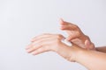 Healthcare concept. Closeup shot of young woman hands applying moisturizing hand cream Royalty Free Stock Photo