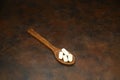 Healthcare concept of ladle with spoon of various medicine tablet, caplets, pills, capsule on rusty background