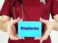 Healthcare concept meaning Blepharitis with inscription on the piece of paper Royalty Free Stock Photo