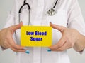 Healthcare concept meaning Low Blood Sugar Hypoglycemia with inscription on the sheet