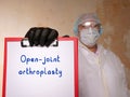 Healthcare concept meaning Open-joint arthroplasty with sign on the piece of paper