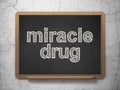 Healthcare concept: Miracle Drug on chalkboard background Royalty Free Stock Photo