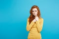 Healthcare Concept - Portrait of young beautiful ginger woman feeling sick and stressful. Isolated on pastel blue Royalty Free Stock Photo