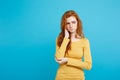 Healthcare Concept - Portrait of young beautiful ginger woman feeling sick and stressful. Isolated on pastel blue Royalty Free Stock Photo